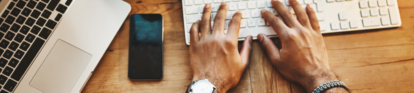 Hands typing on keyboard